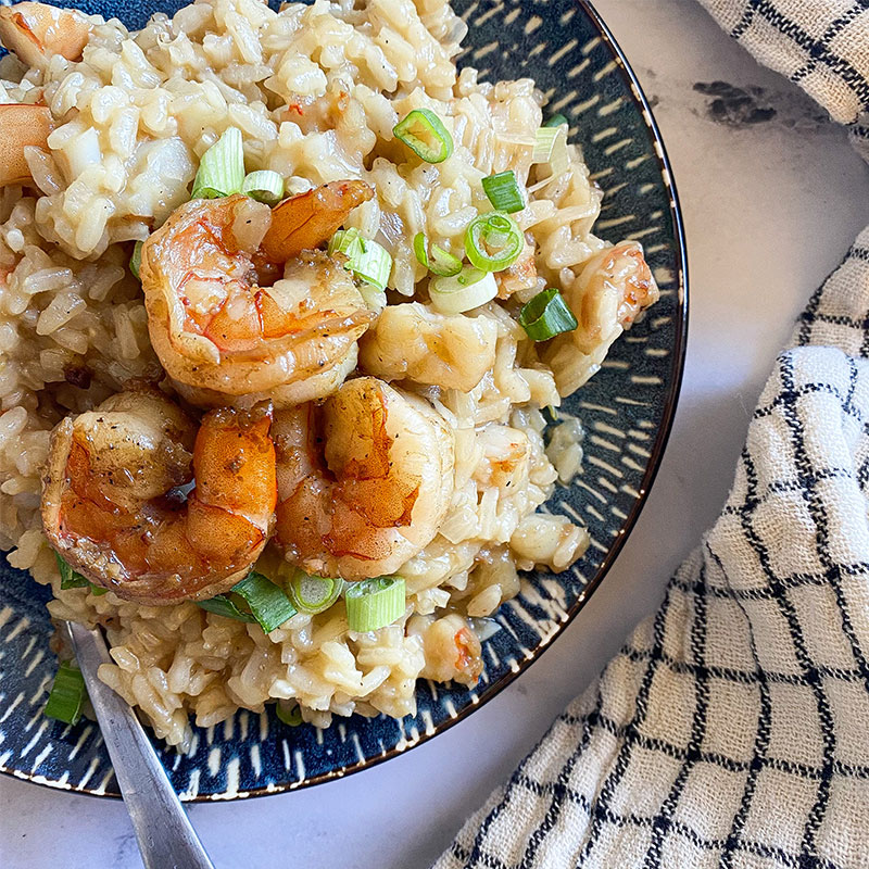 Side view of a plate of Shrimp Risotto.