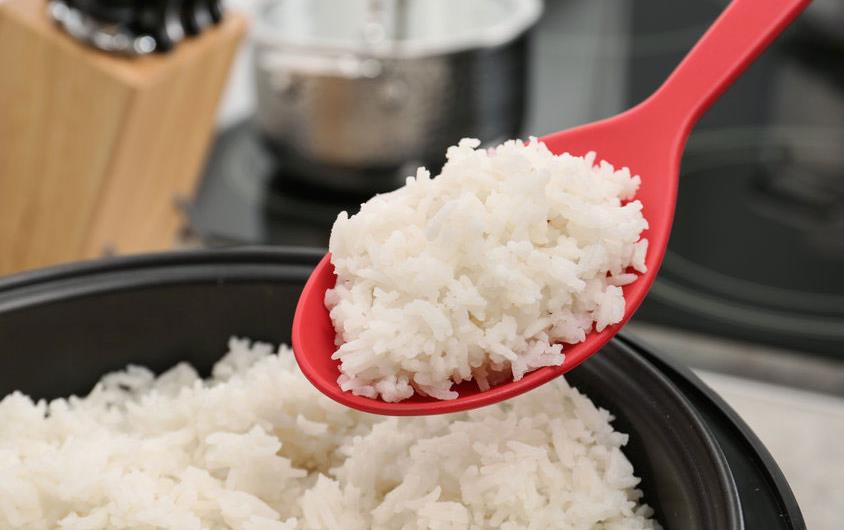 Rice on red spoon