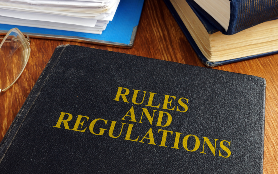 Rule & Regulations book on table