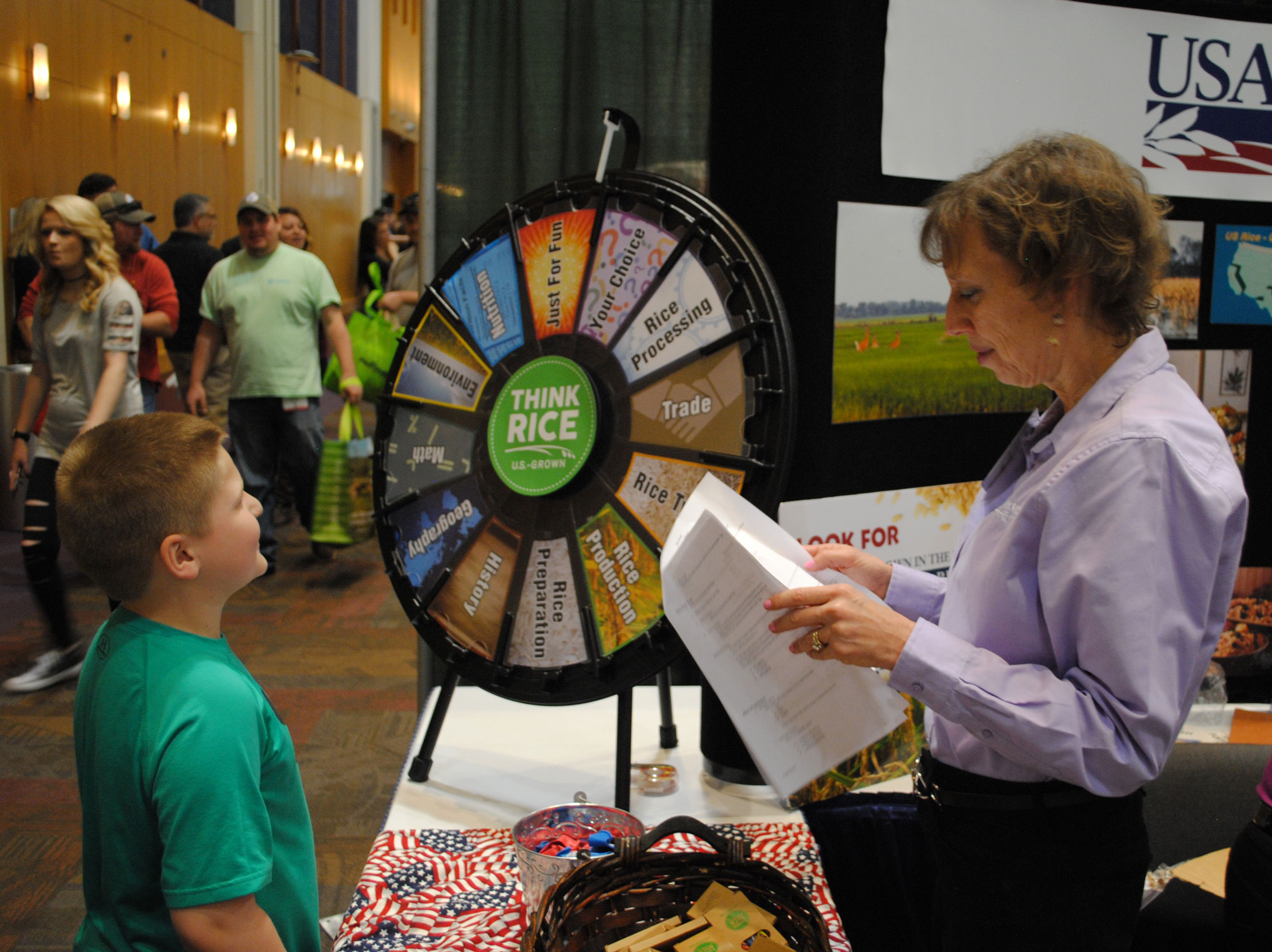 Young boy plays prize wheel trivia at 2018-Gin-Show