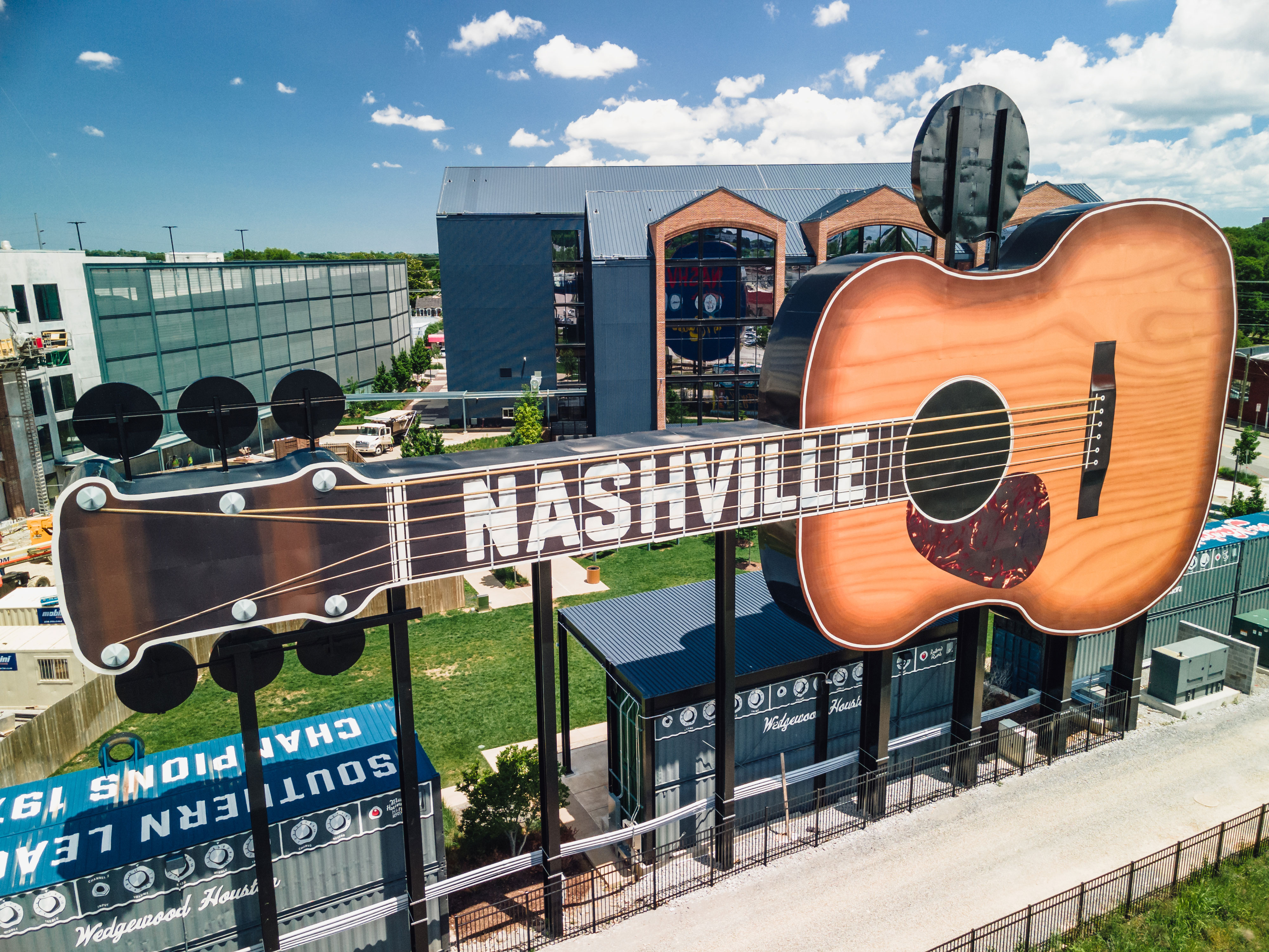 Large guitar with "Nashville" written along the fret board