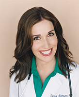 Dr. Tanya Remer Altmann wearing a white lab coat