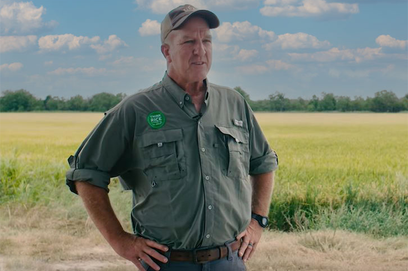 Rice farmer Fred Zaunbrecher standing in front of a field.