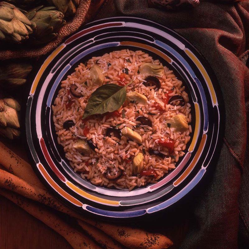 Overhead view of antipasto rice bowl with artichoke 