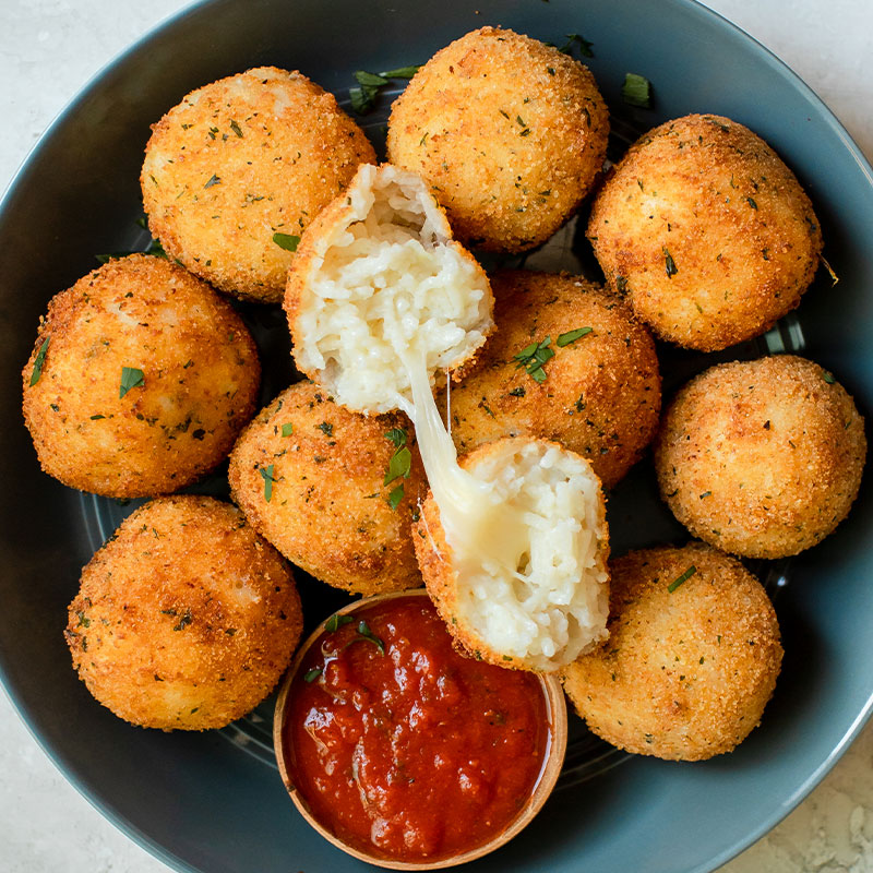 Overhead shot of a platter of arancini.