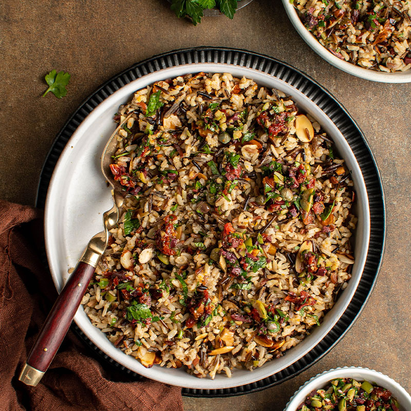 Baked Jeweled Wild Rice Overhead view of Baked Jeweled Wild Rice in a large bowl.