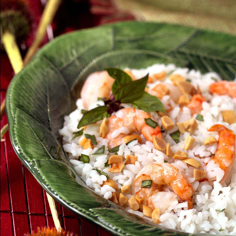 Side view of Bangkok Rice and Shrimp Salad in a green bowl.