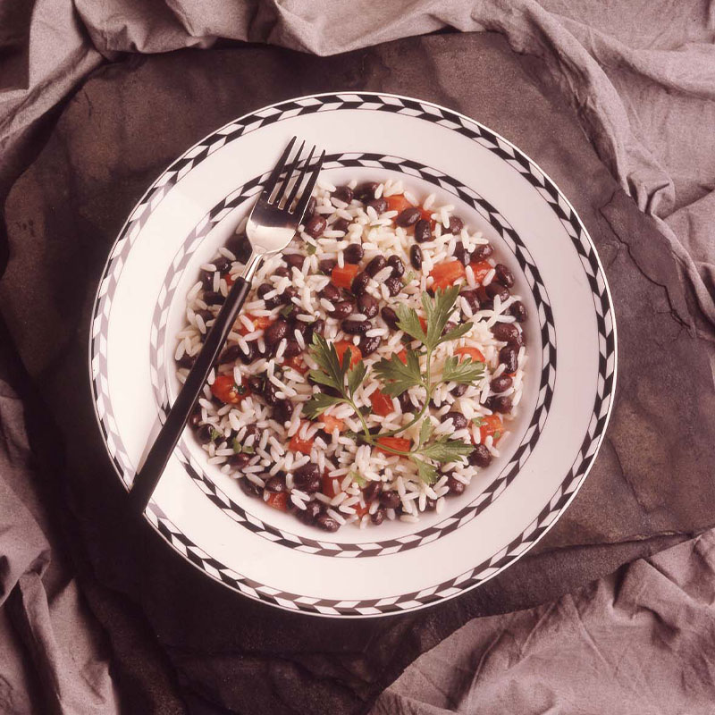 Overhead shot of Black Bean and Rice Salad on a white plate.