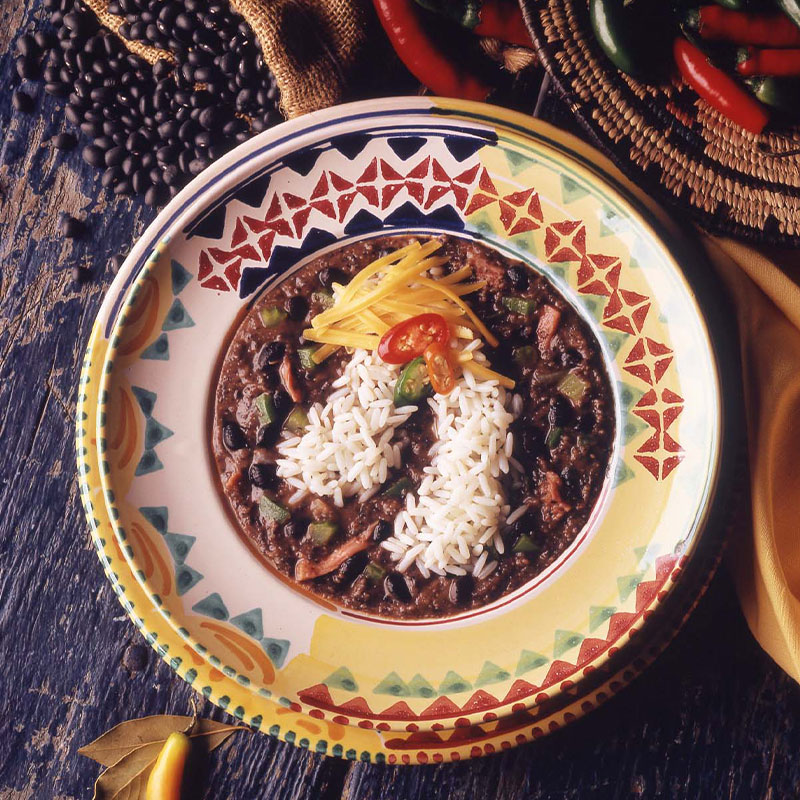 Black Bean Soup Overhead shot of Black Bean Soup with Rice in a colorful bowl.