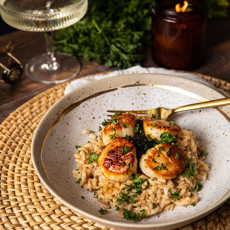 Plate of Champagne Risotto with Brown Butter Scallops.