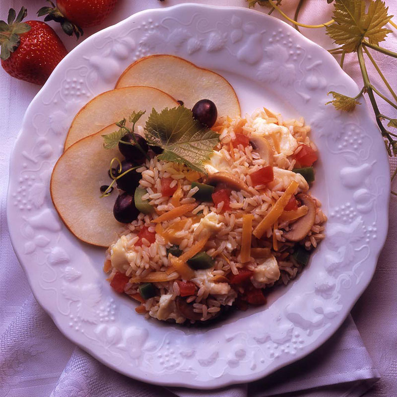 Overhead view of brunch rice on a white plate.