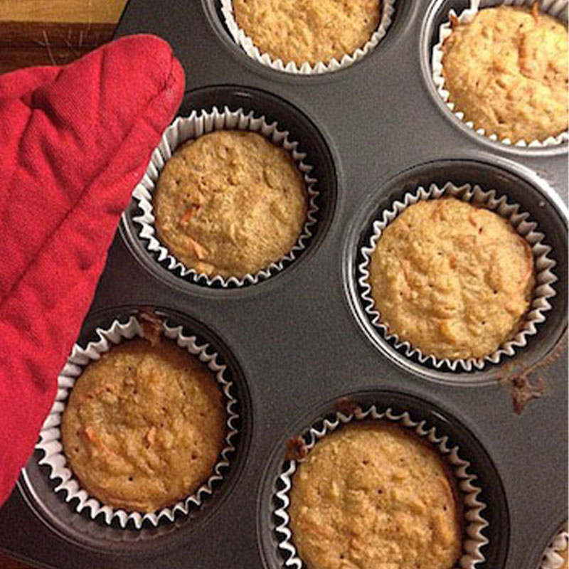 Overhead shot of Carrot, Coconut and Rice Muffins on a muffin pan.