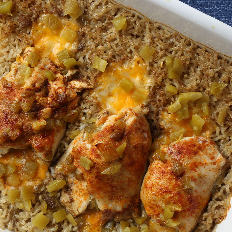 Zoomed in image of a casserole dish of Chicken and Rice Roll Ups