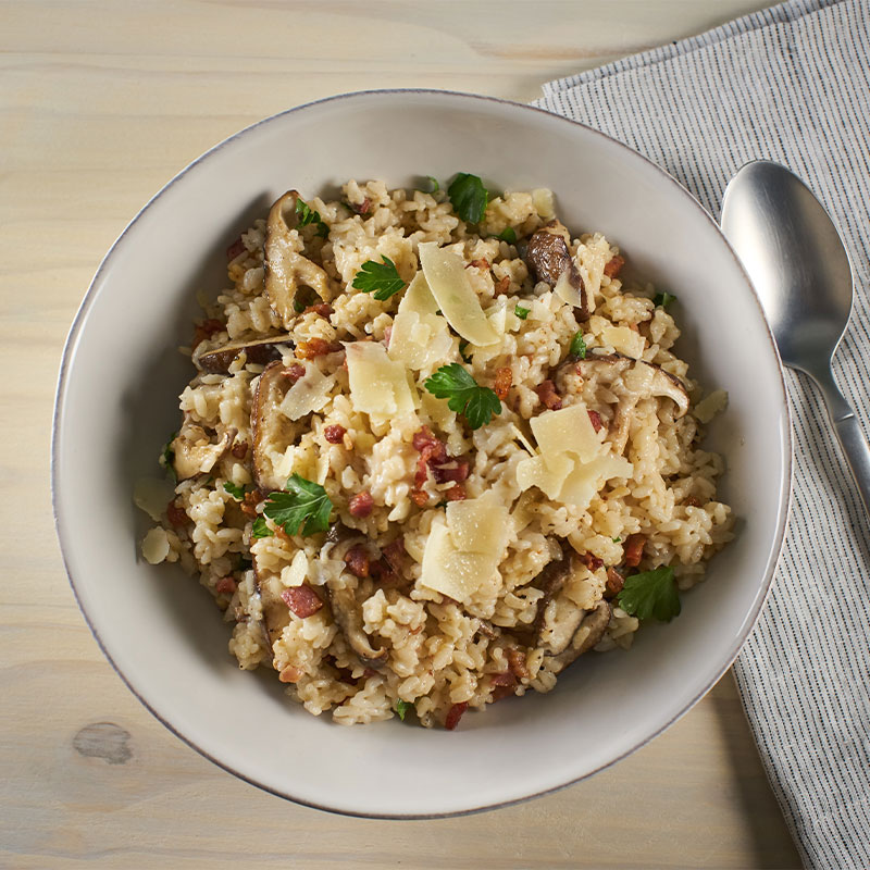 Overhead shot of Creamy Parmesan Rice in a white bowl.