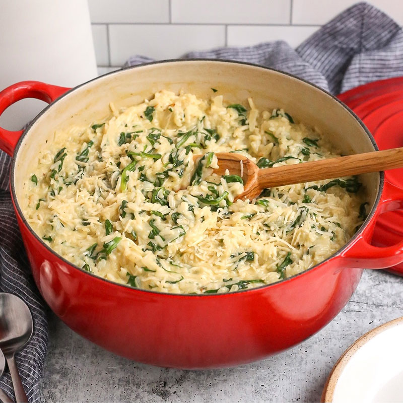 Creamy Spinach Rice in a red pot.
