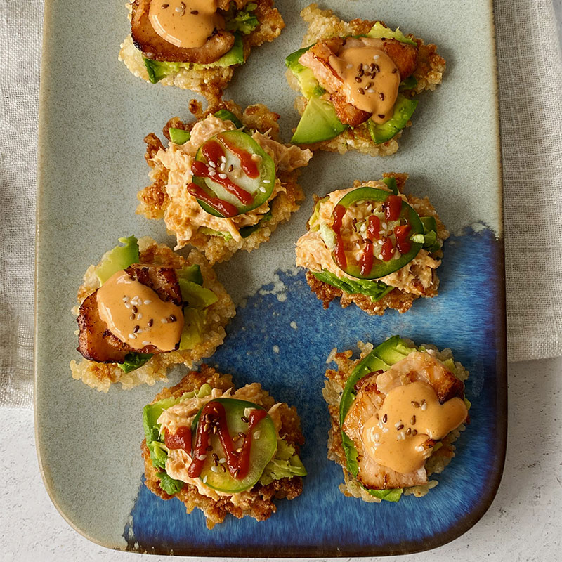 Overhead image of a platter of Crispy Rice with Spicy Cooked Salmon.