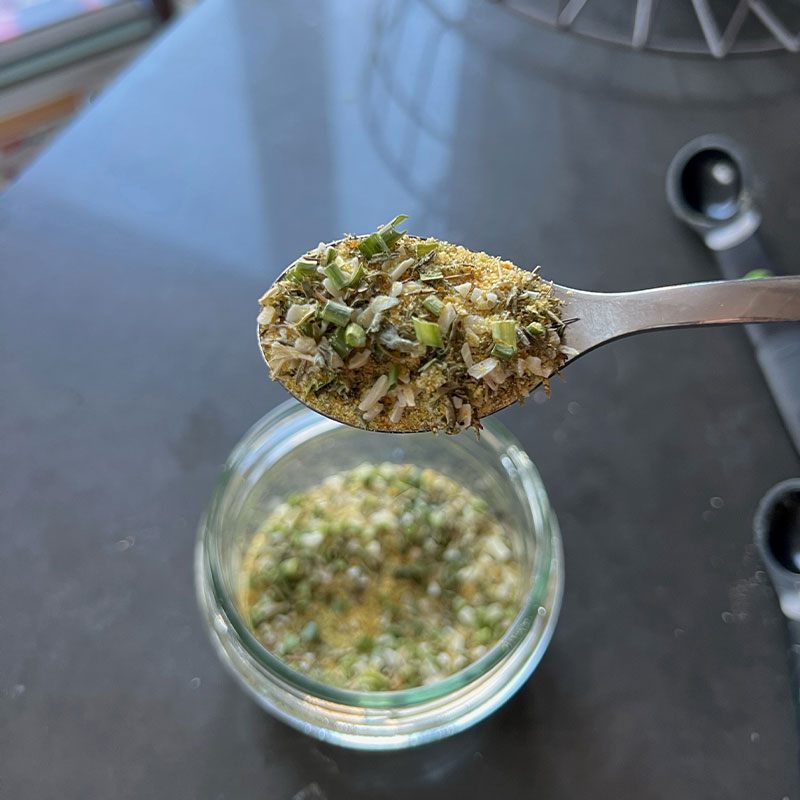 Crunchy Herb Rice Seasoning Image of a spoonful of Crunchy Herb Rice Seasoning.