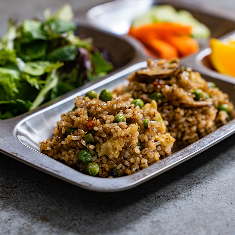 Side view of a serving of Culinary Farm Fried Rice.