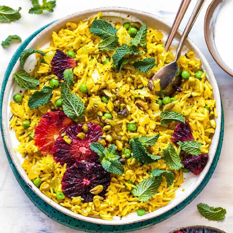 Overhead shot of a bowl full of a colorful Curried Rice Salad.