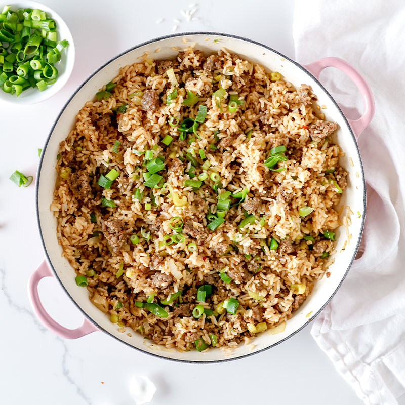 Overhead image of a large pot of Dirty Rice.