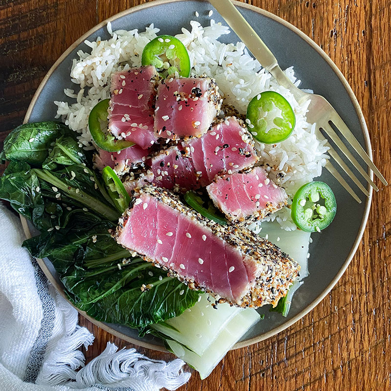 Everything Bagel Seared Tuna Steak Overhead view Everything Bagel Seared Tuna Steak on a plate