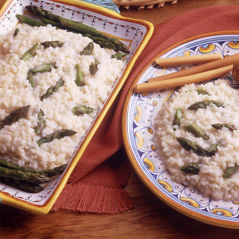 Overhead view of fresh asparagus risotto on a plate.