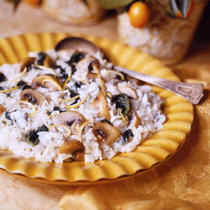 Gorgonzola Lemon Rice Gorgonzola Lemon Rice topped with Mushrooms on a yellow plate.