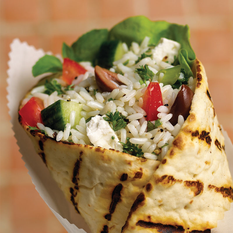 Greek Rice Salad Wrap Close up view of Greek rice salad wrap.