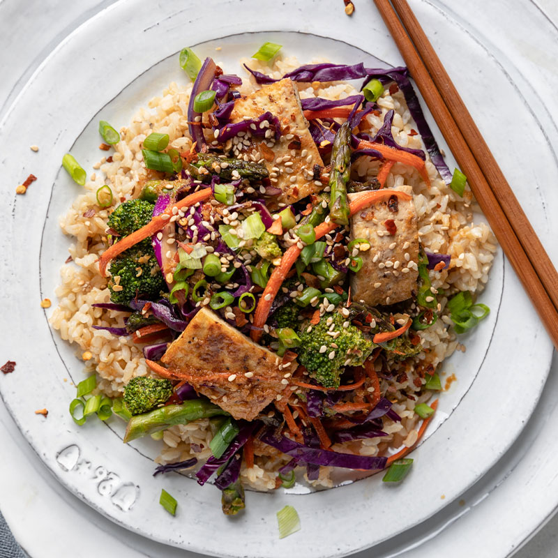 Overhead image of Honey and Ginger Tofu Stir Fry on a bed of brown rice.