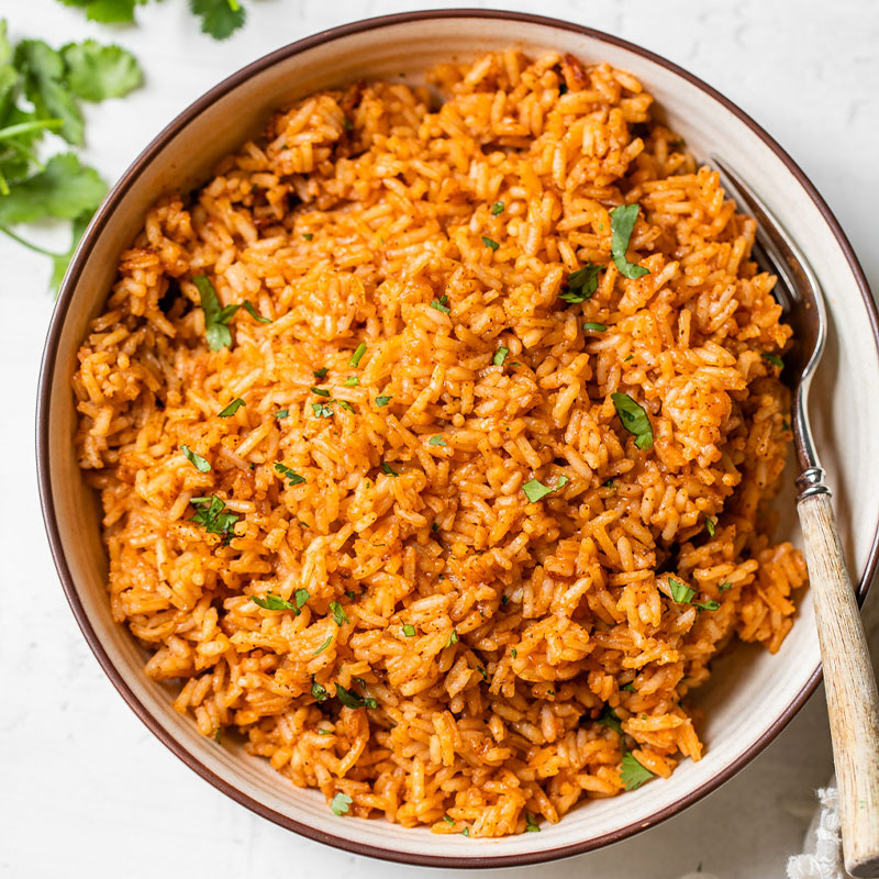 Overhead shot of a bowl full of Spanish Rice topped with cilantro