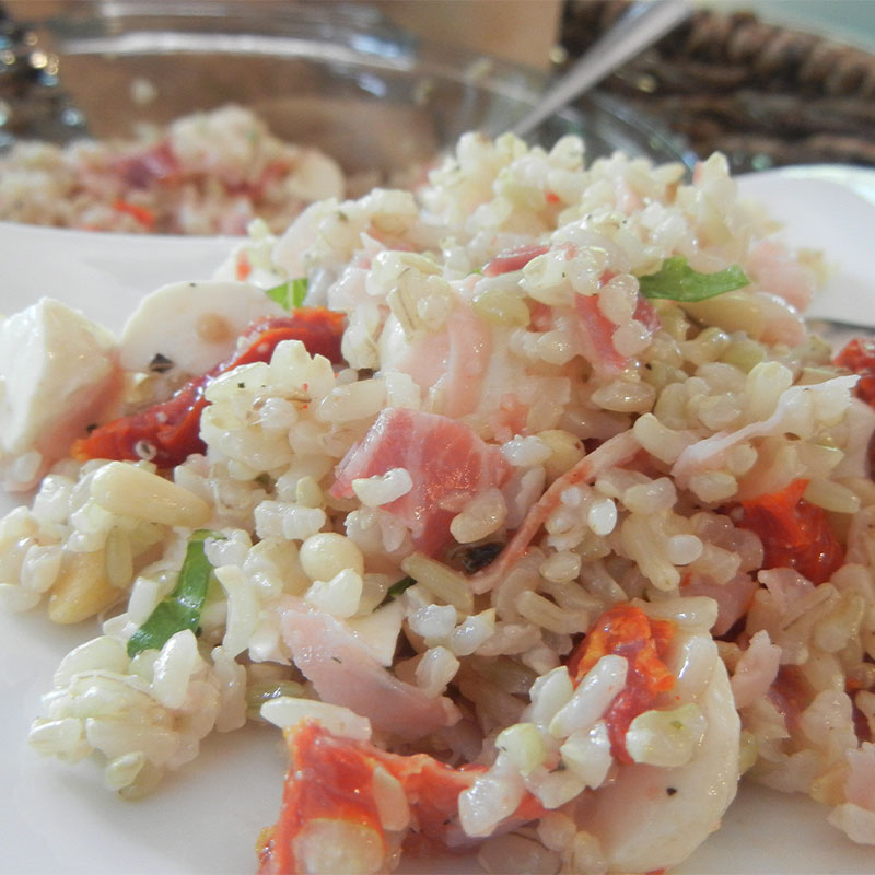 A zoomed in shot of a spoonful of Italian Brown Rice Salad.