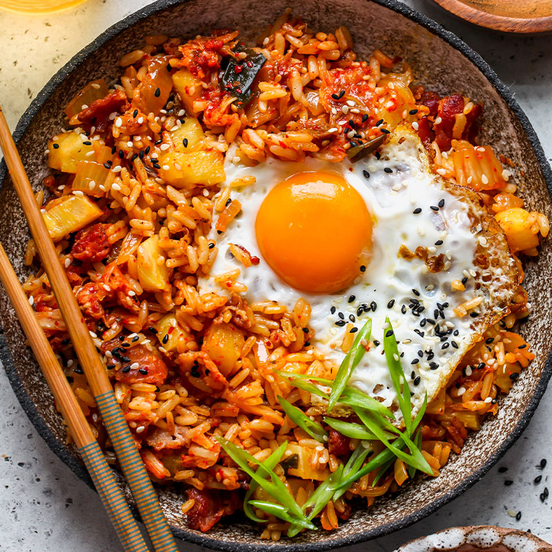 Overhead view of a bowl of Kimchi Fried Rice with Pineapple.