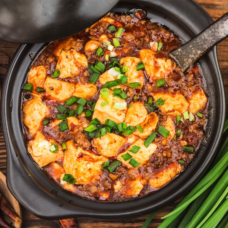 Overhead view of a pot of Mapo Tofu.