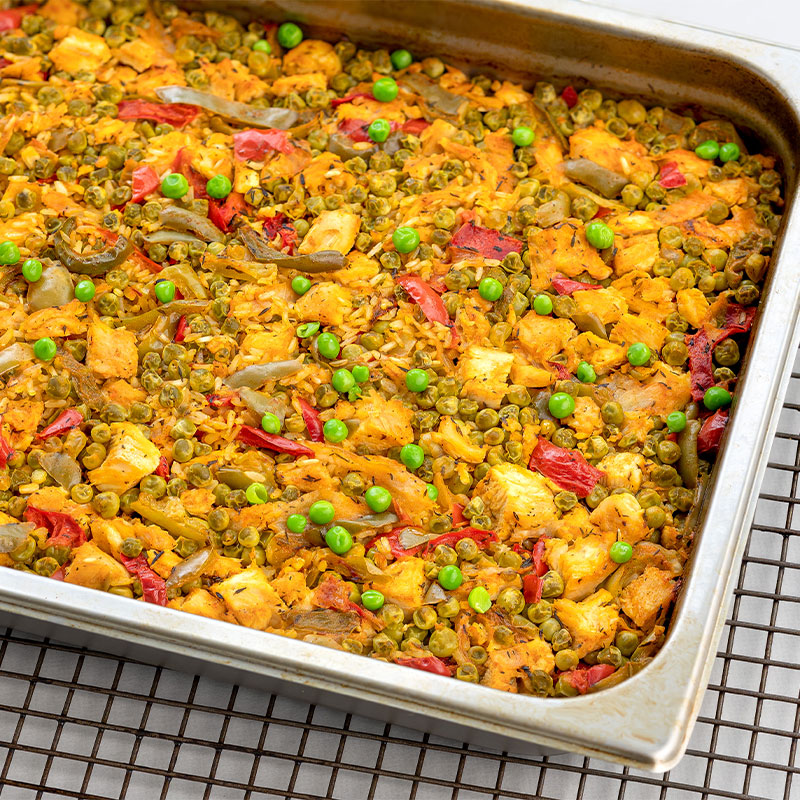 A large tray of colorful Paella