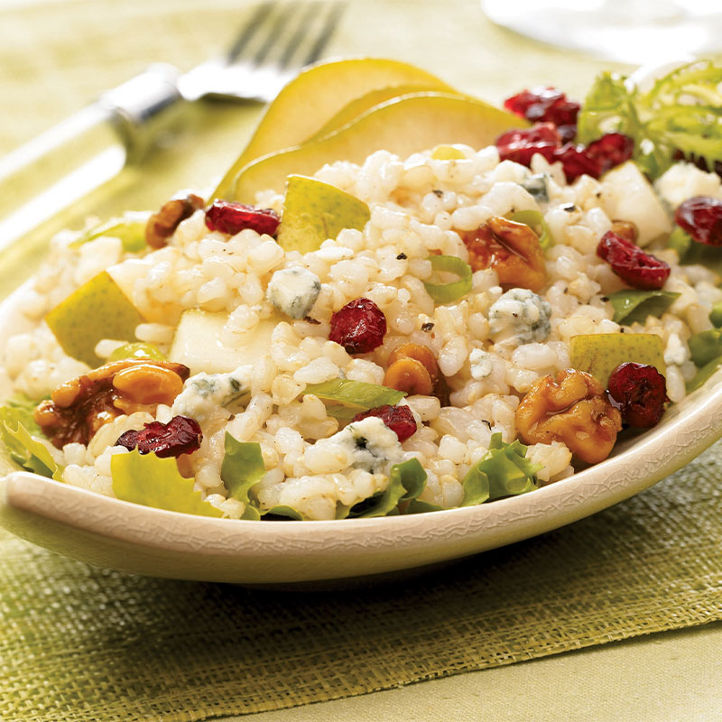 Pear & Walnut Rice Salad with Blue Cheese Pear and Walnut Rice Salad on a serving platter with drizzled Blue Cheese Vinaigrette.