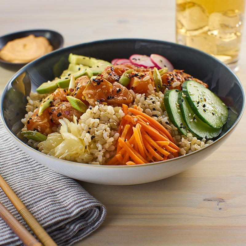 Side view of poke bowl in black and white bowl.