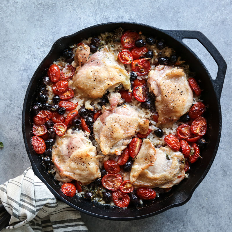 Overhead view of Baked Provencal Chicken and Rice Casserole in a skillet.