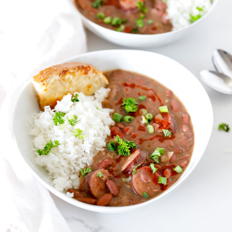 A serving of Red Beans & Rice in a white bowl.