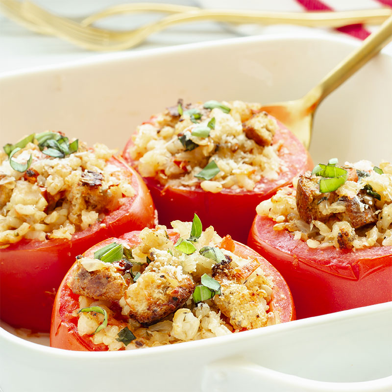 Rice Stuffed Baked Tomatoes Zoomed in image of four Rice Stuffed Baked Tomatoes.