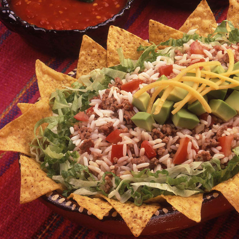 Overhead view of rice taco salad on a serving plate.