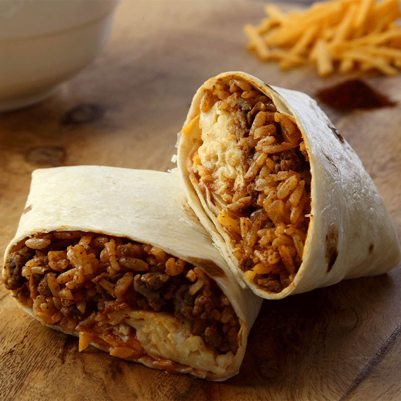 Sausage Breakfast Burritos Side profile of a Breakfast Sausage Rice Burrito cut in half.