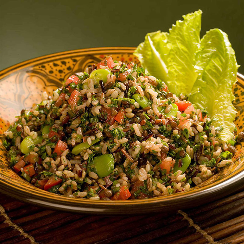 Seven-Rice Tabbouleh Salad neatly plated with crisp lettuce leaves on the side.