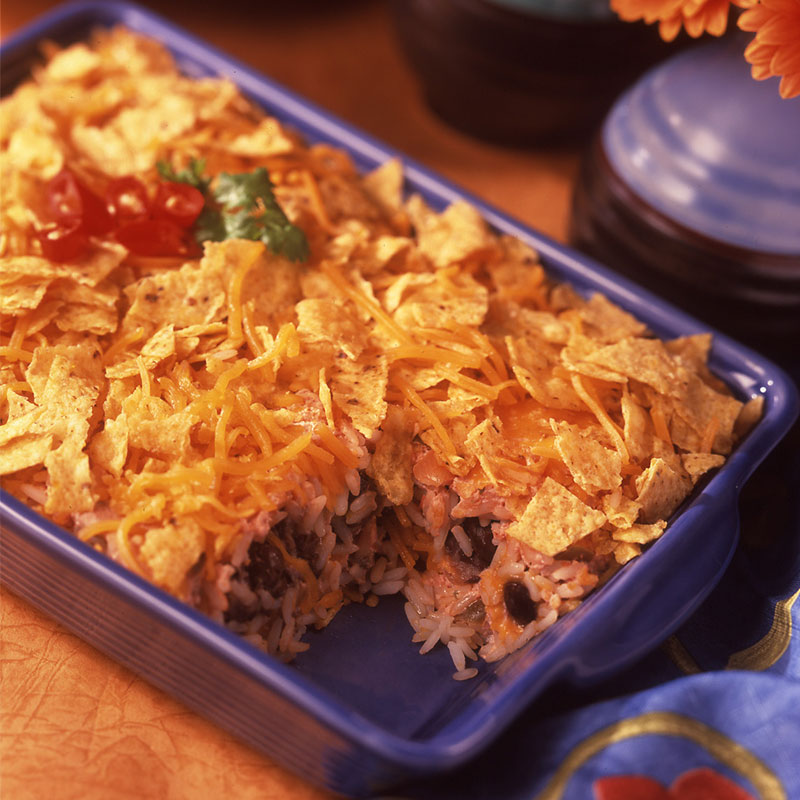 Side view of south-of-the-border lasagna in a blue casserole dish.