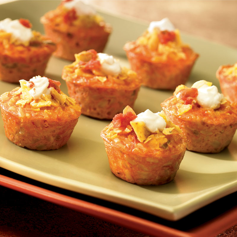 Side view of salsa rice bites on a green serving platter.