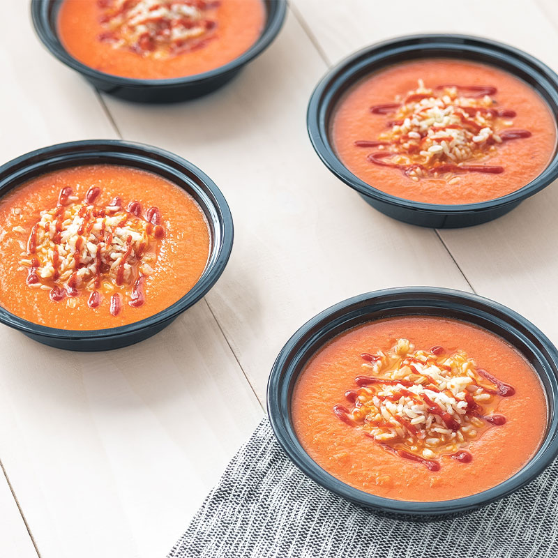 Side view of four bowls of Sriracha Tomato & Rice-Soup