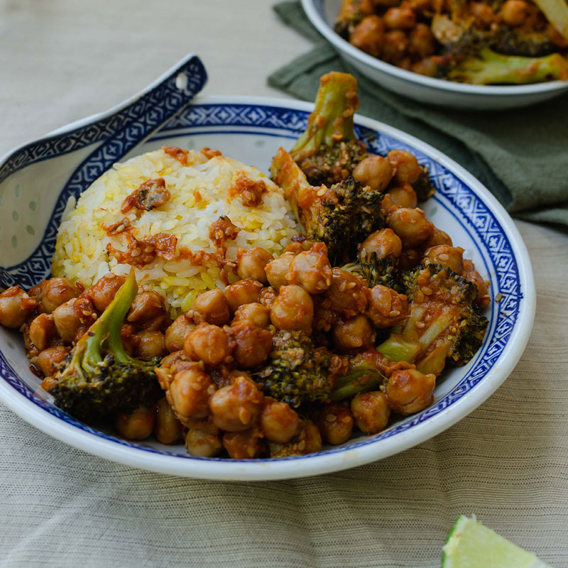 Sweet & Sour Chickpeas with Broccoli Zoomed in image of a plate of Sweet & Sour Chickpeas with Broccoli.