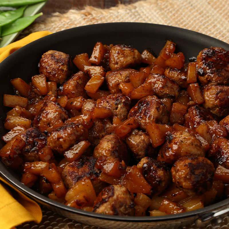 Overhead image of Turkey Sausage Rice Balls with Pineapple in a stove top pan. 