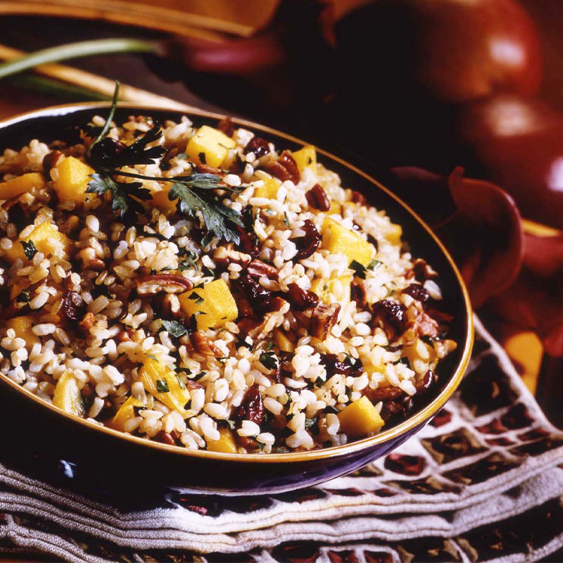 Zoomed in image of Tutti Fruitti Rice Salad in a bowl topped with parsley.