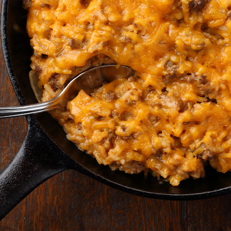 Zoomed in view of a skillet of Two Cheese Mexican Rice
