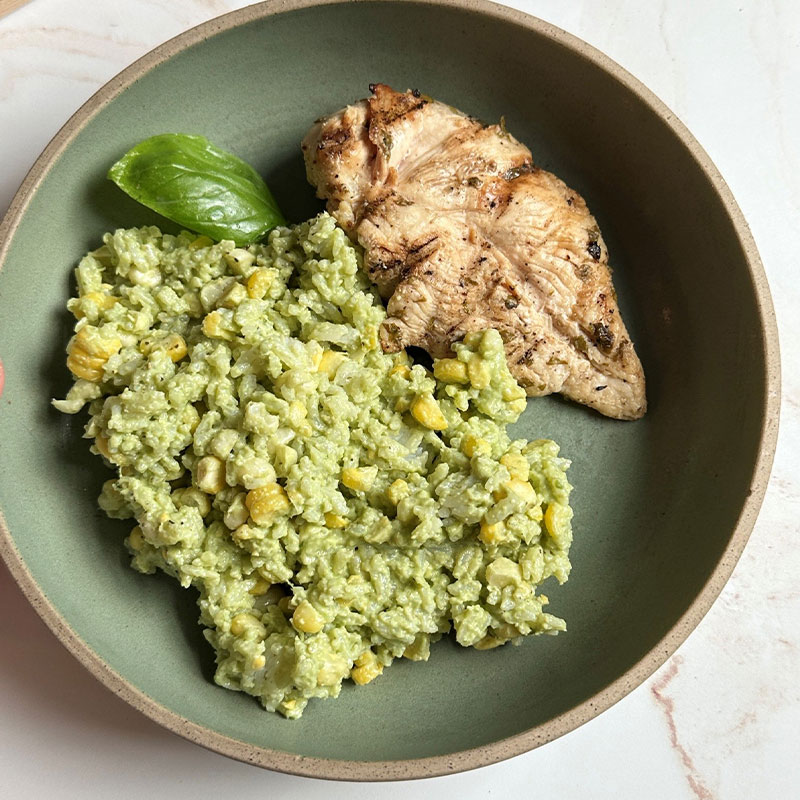 Walnut Pesto Rice with Fresh Summer Corn A plated side of Walnut Pesto Rice with Fresh Summer Corn.